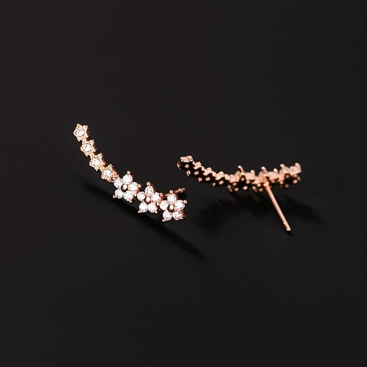 Valeria™ – Pendientes Trepadores de Brillo Floral