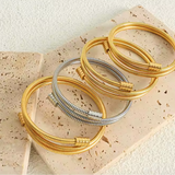 Pulsera de oro retorcida
