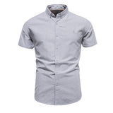 Camisa de manga corta con solapa para hombre en color liso