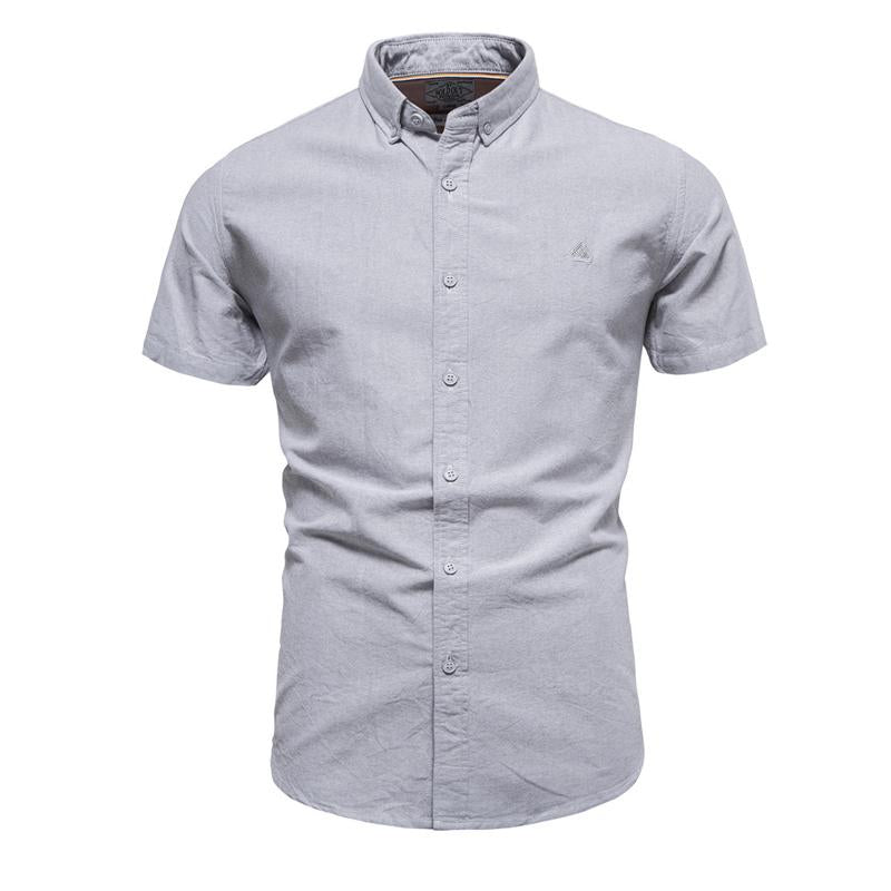 Camisa de manga corta con solapa para hombre en color liso