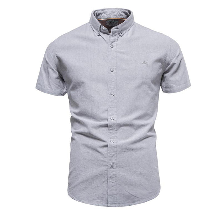 Camisa de manga corta con solapa para hombre en color liso